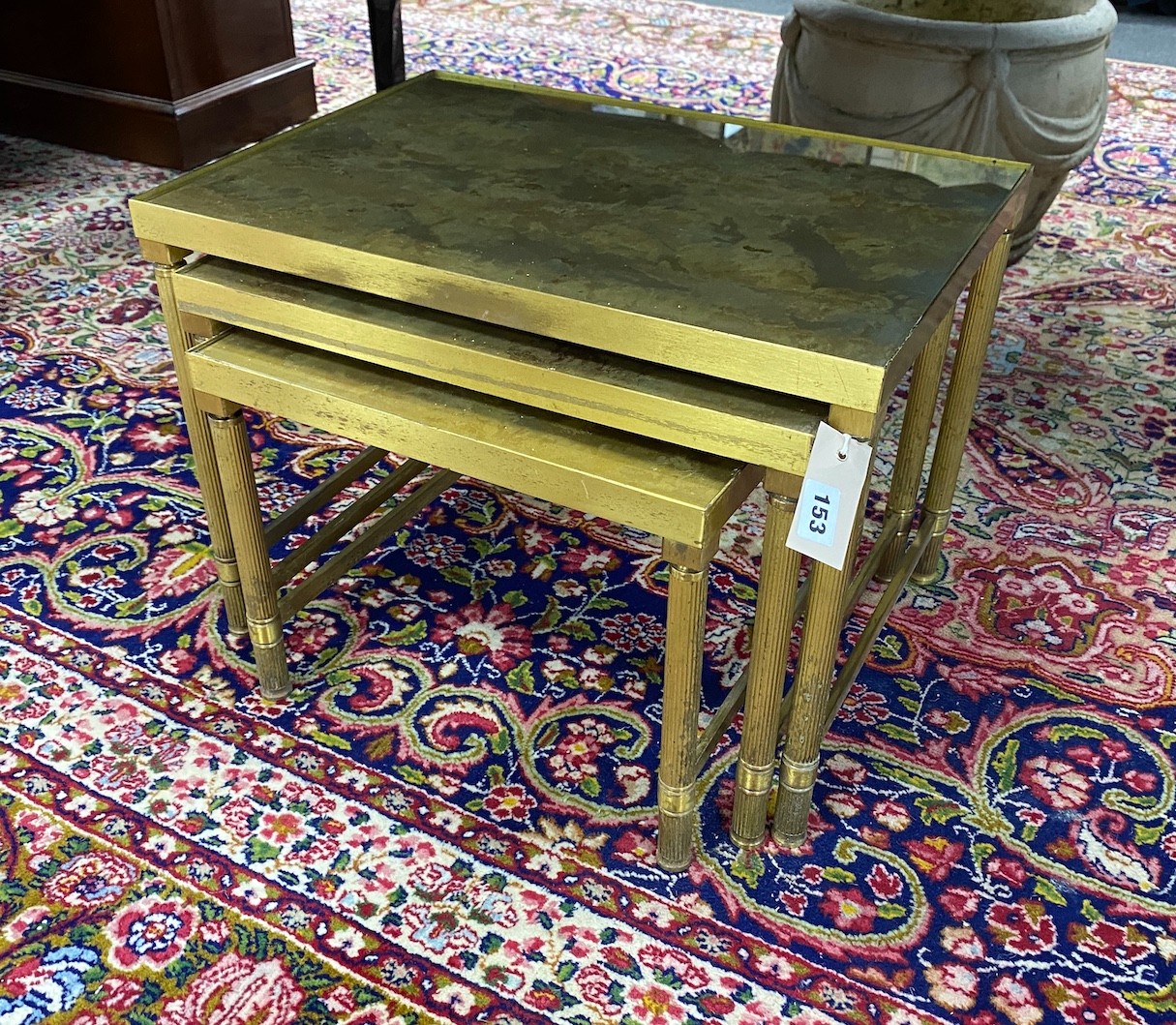 A nest of three Maison Jansen style glass top brass occasional tables, width 50cm, depth 36cm, height 36cm
